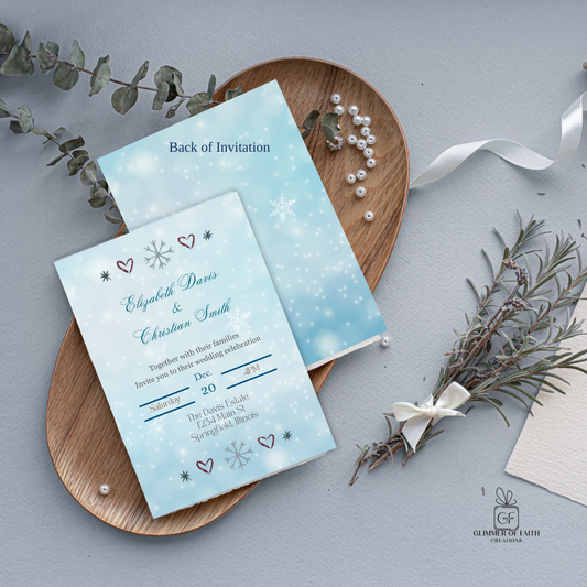 Wedding invitation cards with snowflake design on a gray surface with decorative elements.