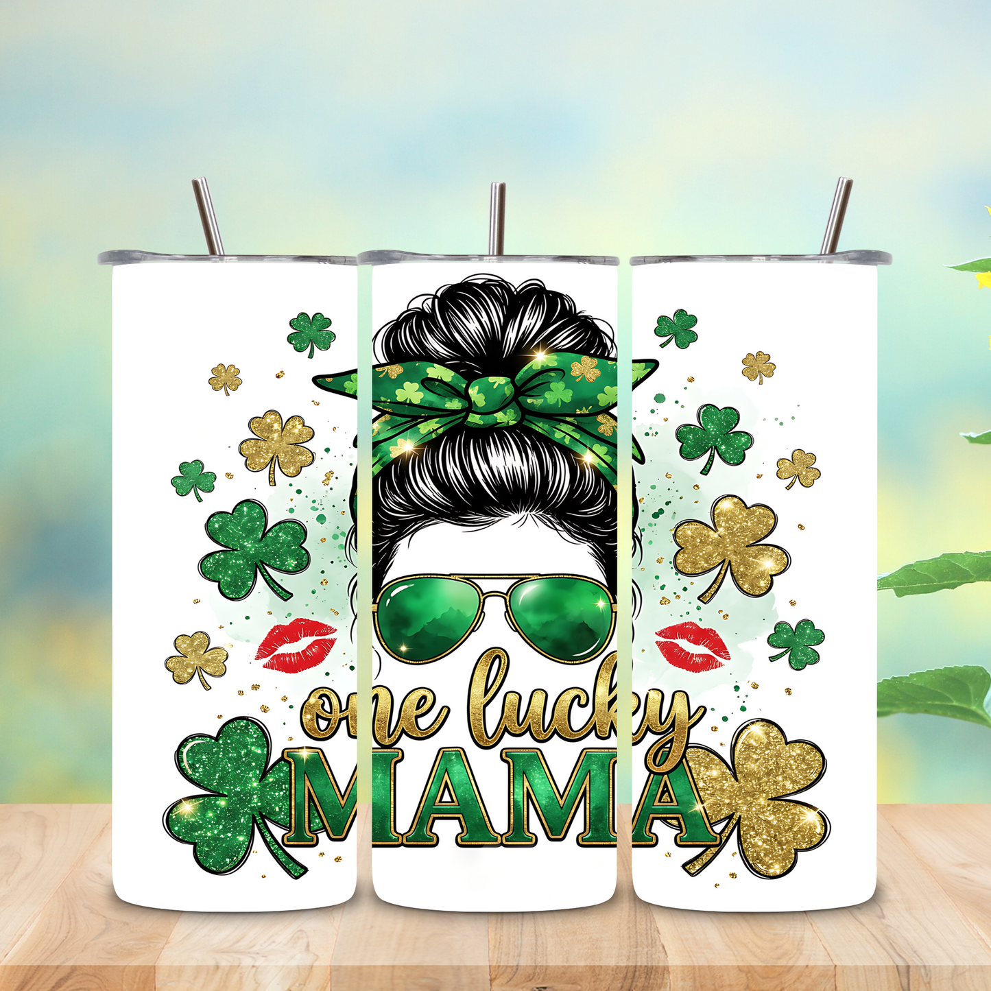 Three tumblers with a design of a woman with a green hair bun, sunglasses, and the text 'one lucky mama' on a wooden surface with a sunflower in the background.